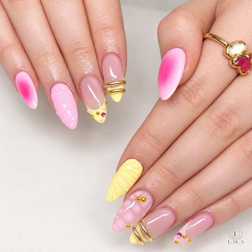 Pink ombre nails with gold details at Lala Nails Spa in Winnetka, CA